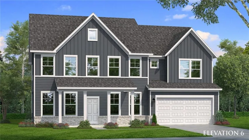Two-story residence featuring a dark gray facade with white trim, a covered porch with pillars, an attached two-car garage, and a gabled roofline