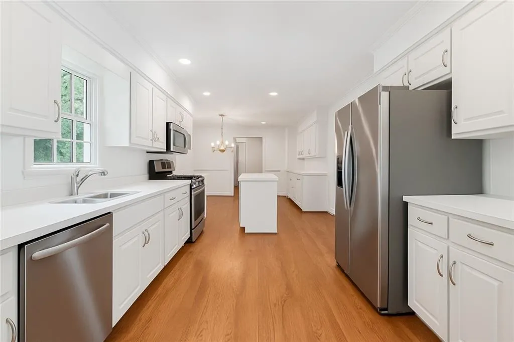 Virtual Image of Kitchen with White Cabinets and Wood Flooring