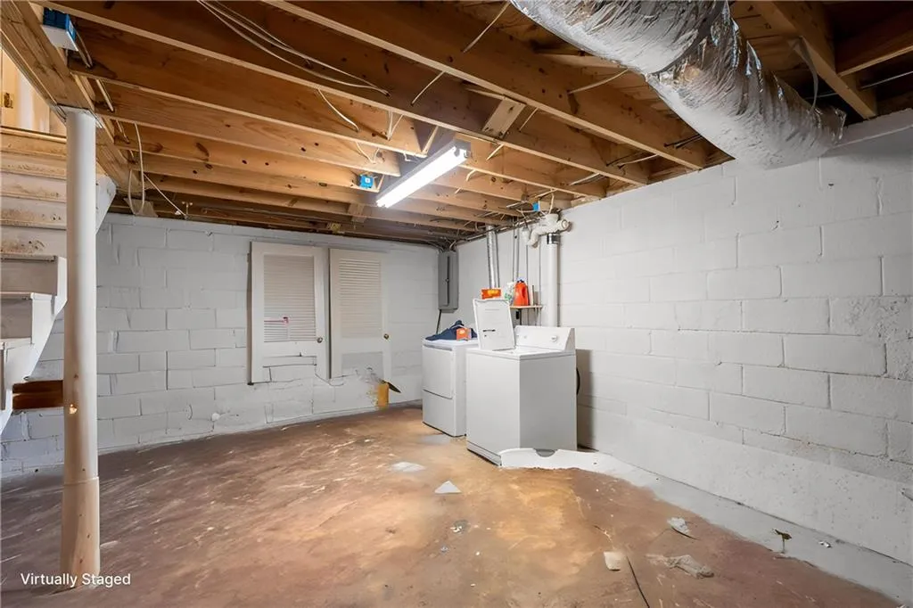 Laundry area in the unfinished basement