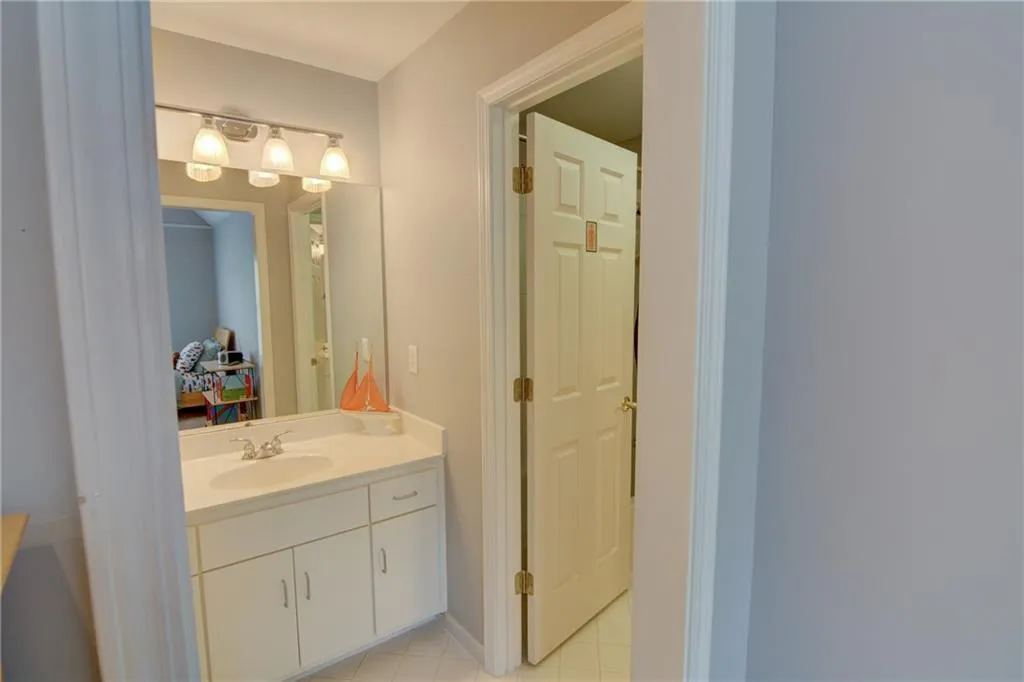 Bathroom with vanity and light tile patterned floors