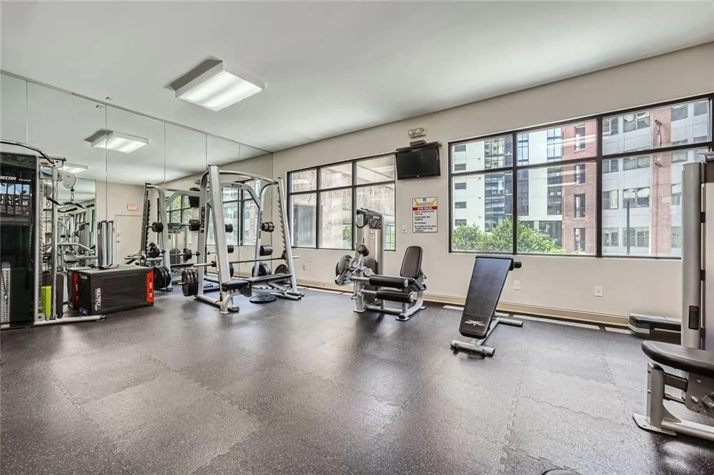 Workout area featuring baseboards