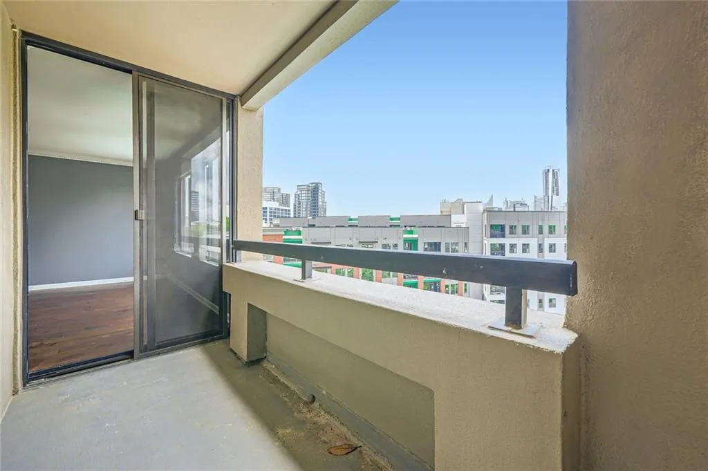 Balcony featuring a view of city
