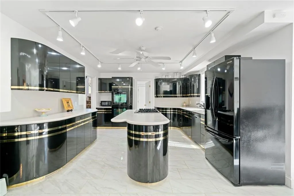 Another view of expansive kitchen. Lots of natural light and an abundance of storage