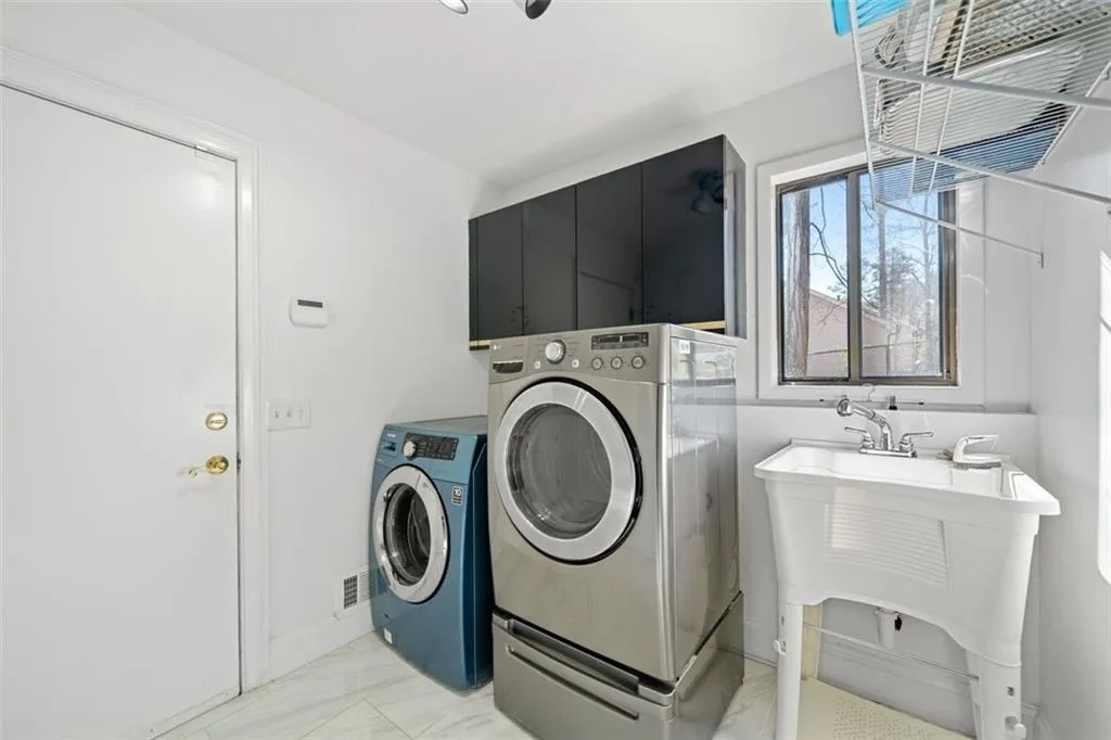 Laundry room with utility sink off kitchen