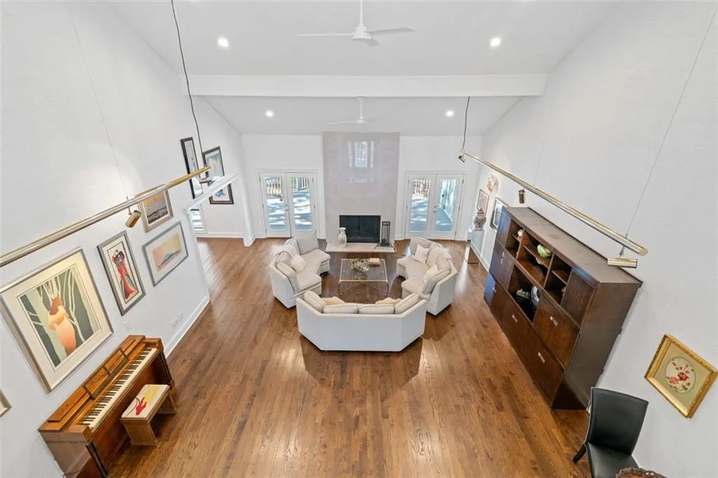 Looking down from upstairs catwalk to magnificent2-story great room