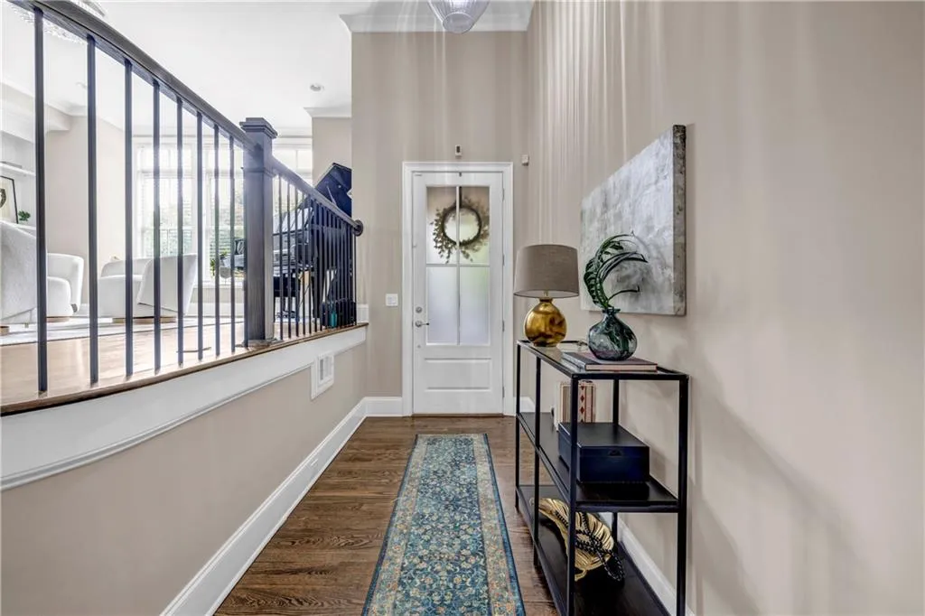 Entryway with wood finished floors and baseboards