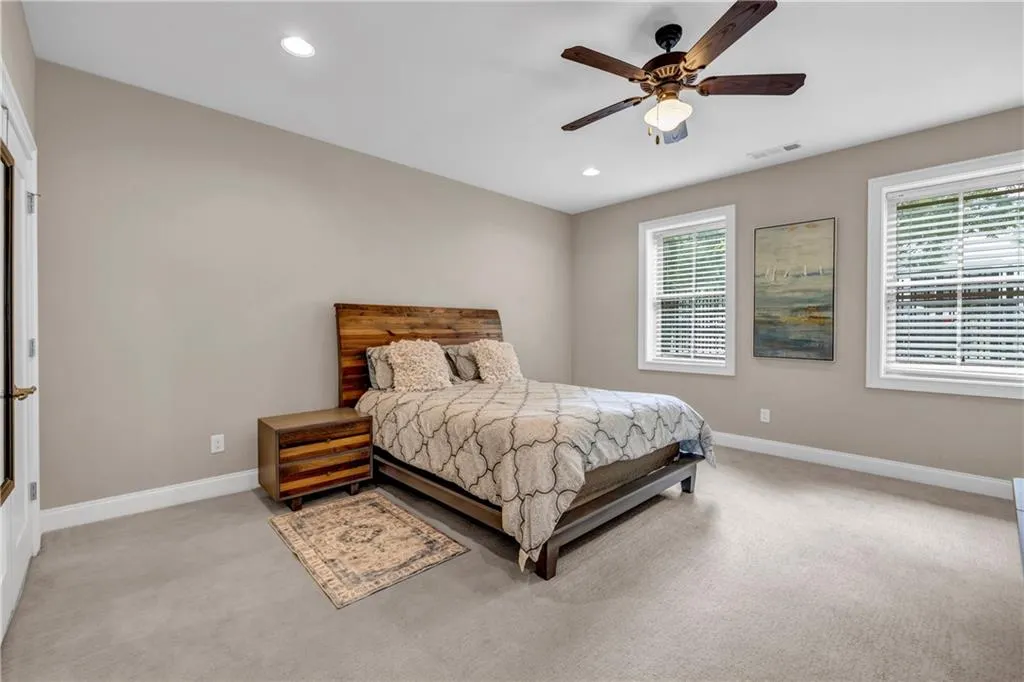 Bedroom with carpet flooring, recessed lighting, and ceiling fan