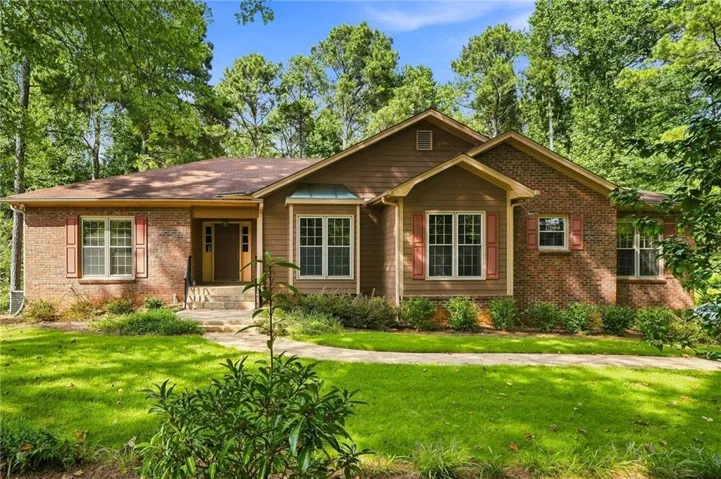 Brick and wood siding exterior with a gabled roofline