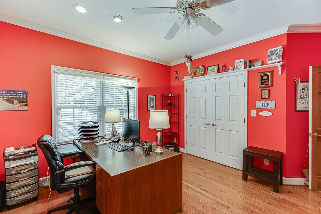 Office featuring ornamental molding, ceiling fan, and light hardwood / wood-style flooring