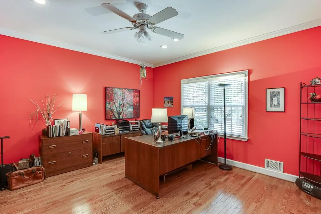 Office featuring ceiling fan, light hardwood / wood-style flooring, and ornamental molding