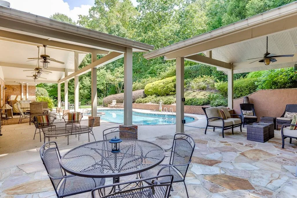 View of patio with an outdoor hangout area and ceiling fan