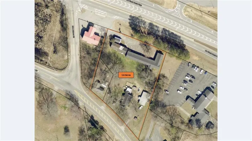 Aerial overview of property's location featuring property parcel outlined