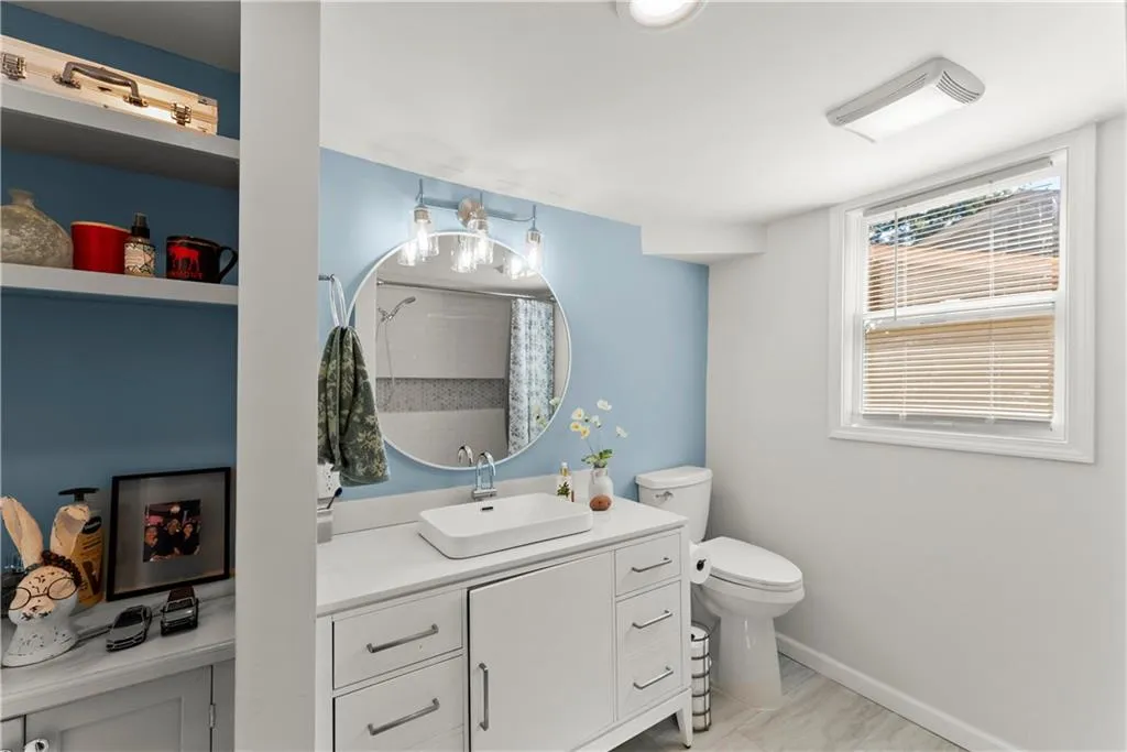 Bathroom featuring vanity and a shower with curtain