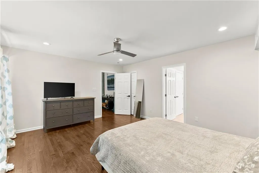 Bedroom featuring recessed lighting, wood finished floors, and a ceiling fan
