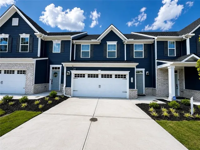 Dark blue siding exterior with white trim accents