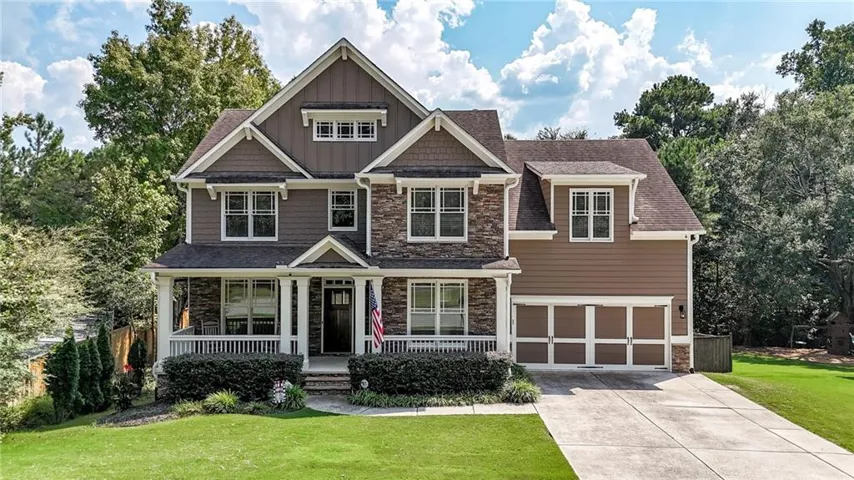 Welcome home to this beautiful craftsman style home with a desirable rocking chair front porch.
