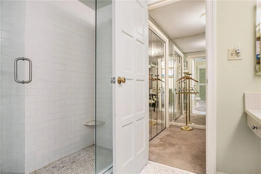 Bathroom featuring a stall shower and vanity Bathroom featuring a stall shower and vanity