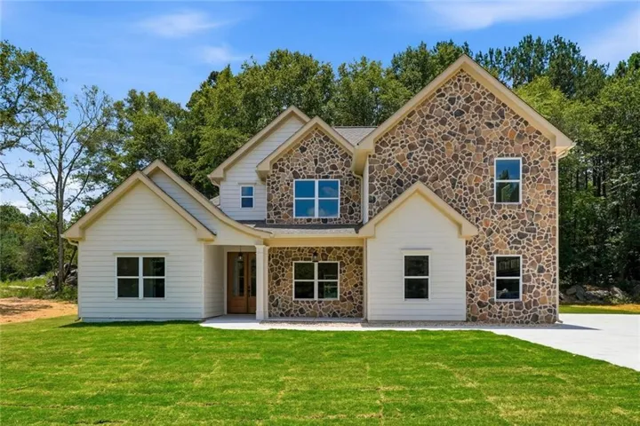 Stone and siding exterior with multiple gables