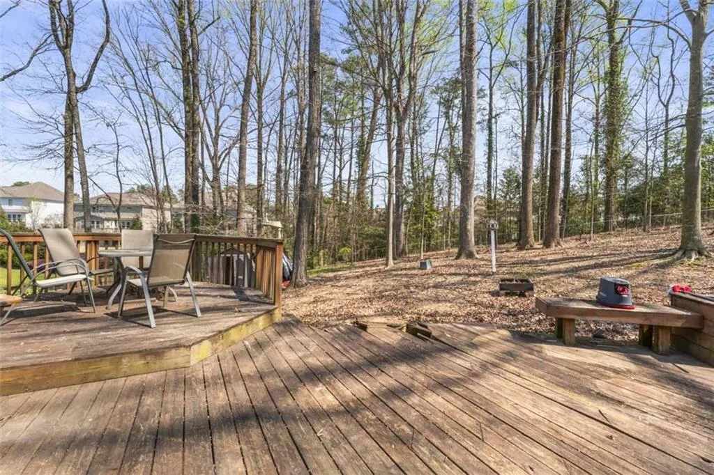 Wooden deck overlooking the backyard.