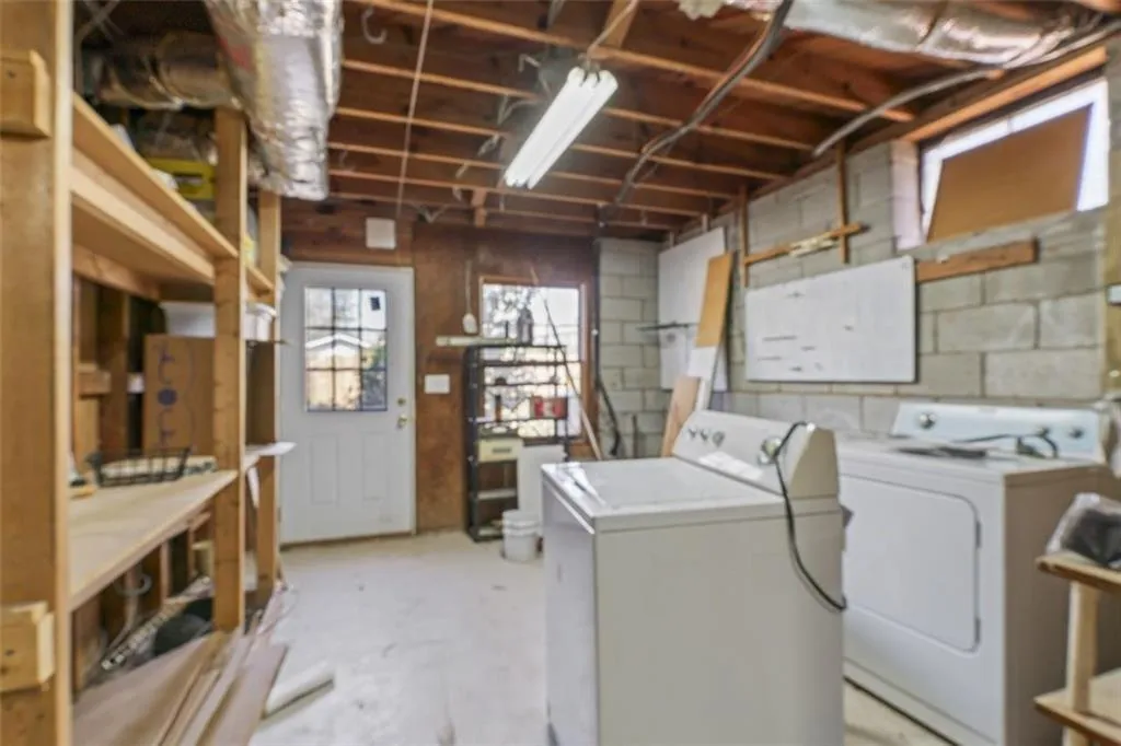 Laundry room in unfinished portion of the basement.