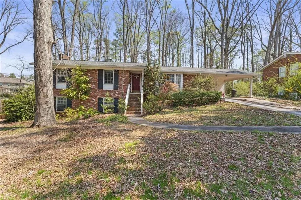 View of front of property with a carport