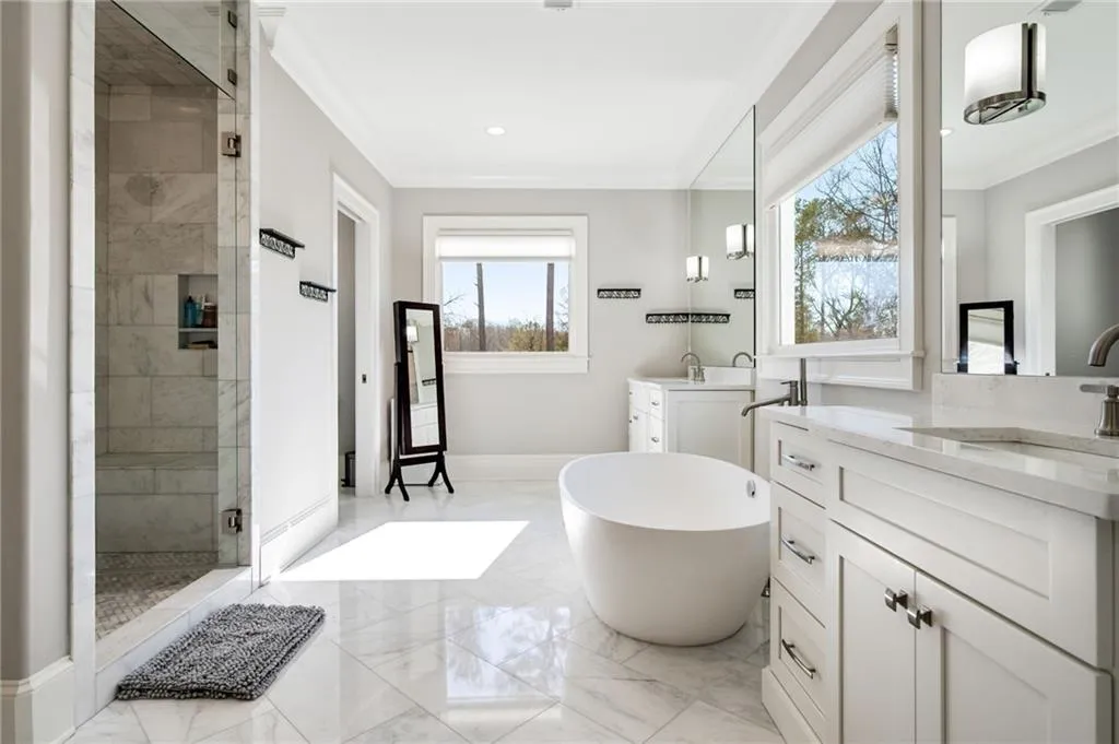 Primary bath includes soaking tub, double vanities and separate shower
