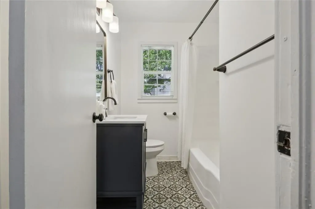 Updated full bath is centrally located in the hall