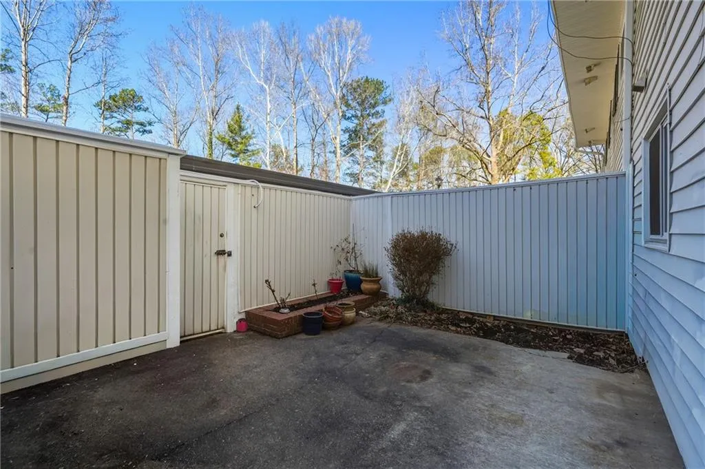 View of patio with a gate