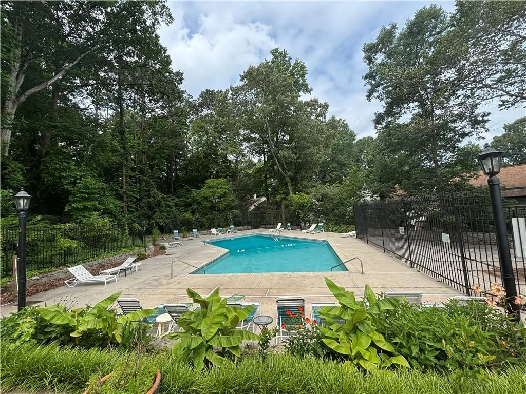 Community pool featuring a patio area