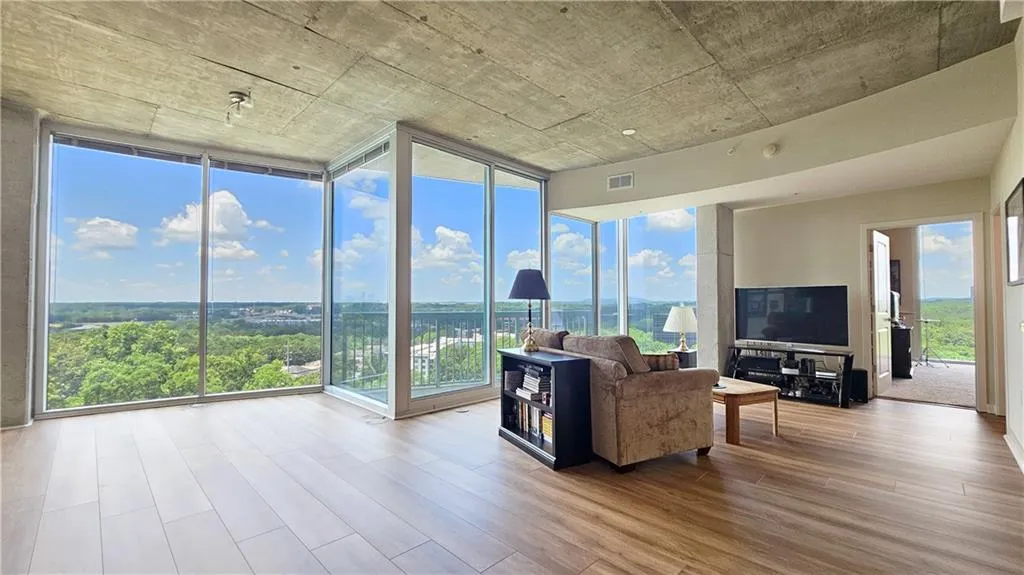 Living room featuring wood finished floors and plenty of natural light