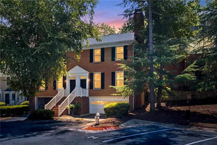 Red brick exterior with white trim