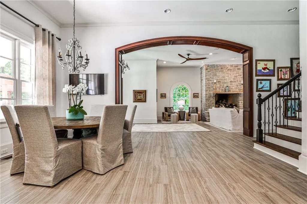 Informal dining area overlooks the pool and back yard, opens to family room. Laundry room is to the right, behind the secondary staircase.