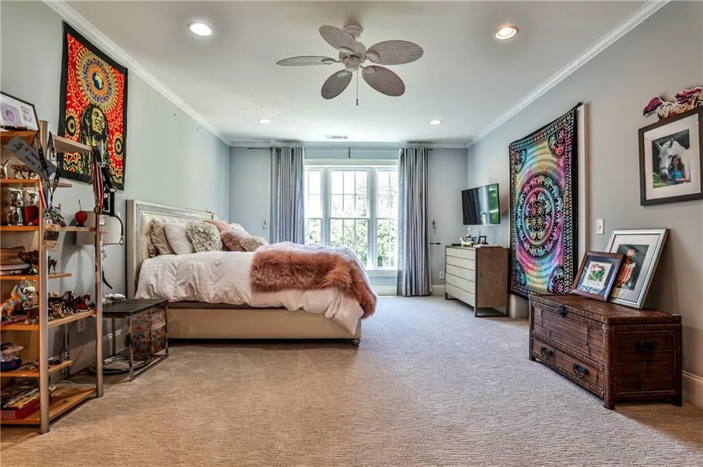Upstairs bedroom suite with adjoining sitting room, walk in closet and full bath.