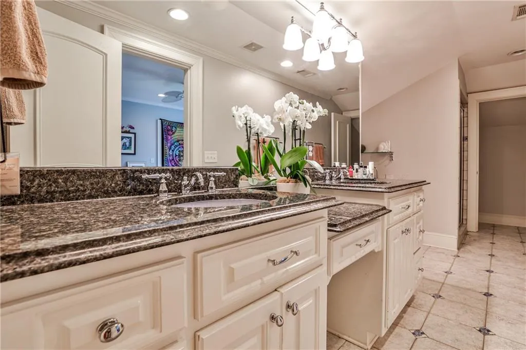Full bath with separate tub/shower in upstairs suite.
