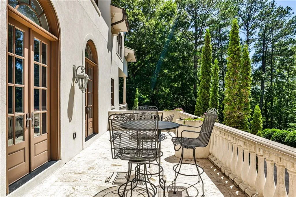 Stone terrace spans the front of the house, accessible from dining and family rooms. Perfect for entertaining.