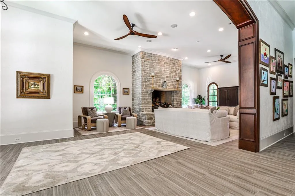 Family room with stone fireplace off kitchen