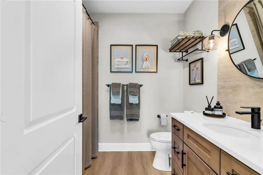 Secondary bathroom includes Kohler soaker tub.