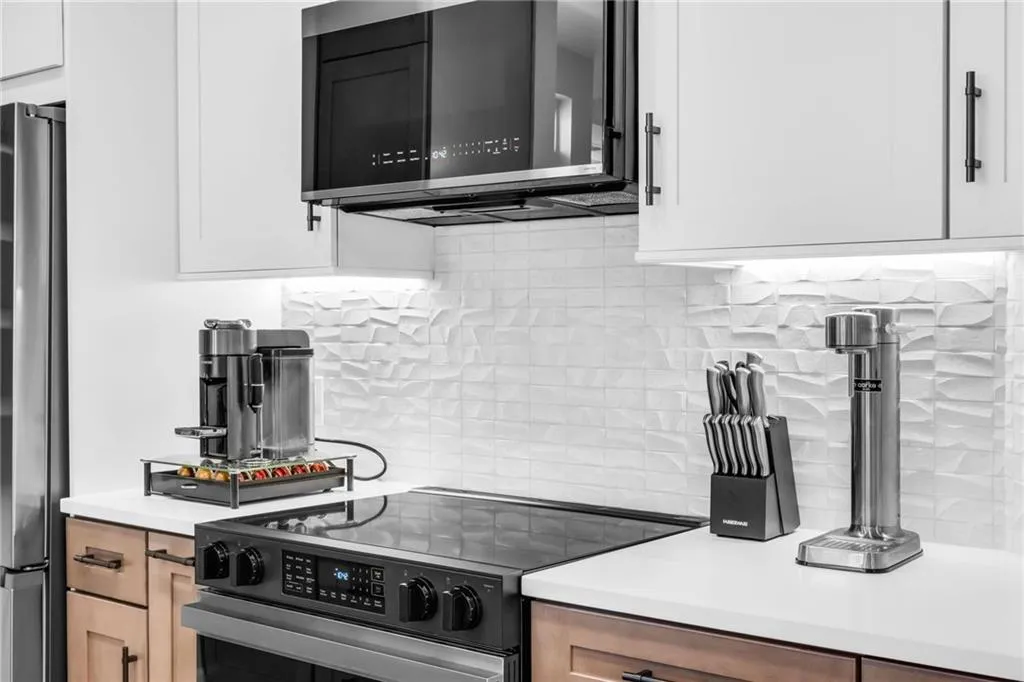 Porcelanosa tile was used for the backsplash & includes undermount cabinet lighting.