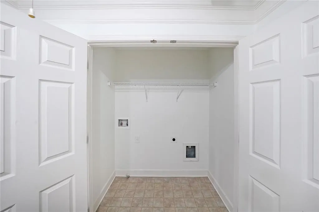 Laundry area with washer hookup and electric dryer hookup