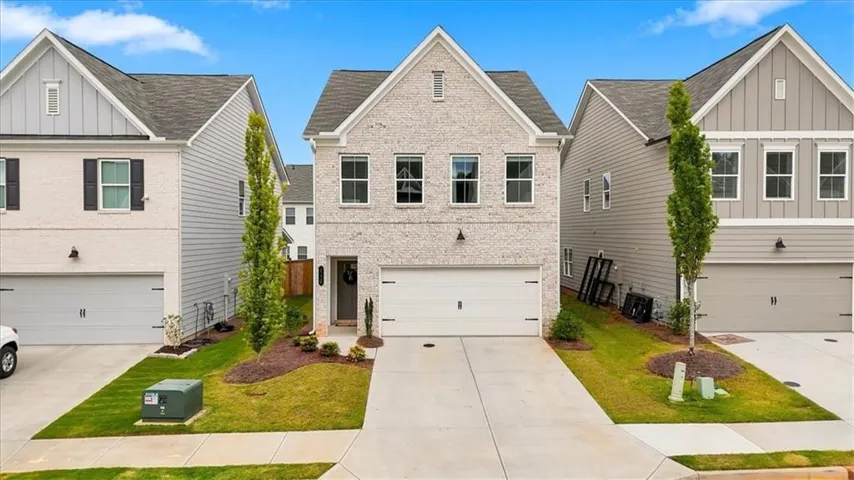 Elegant Brick Front Single Family Home with Level Driveway