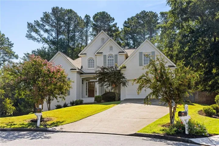 White brick exterior with a gabled roofline