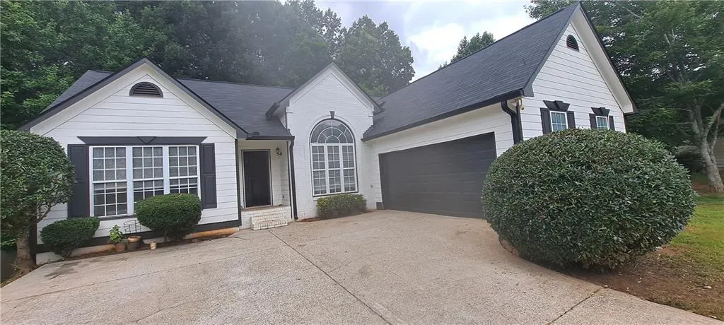 White exterior with dark trim and black shutters