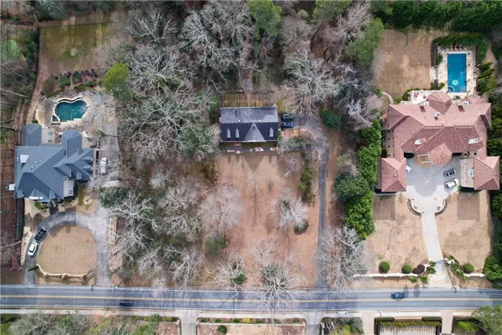 Aerial overview of property's location with a pool