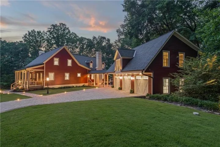 Front of Structure - Twilight Front right side of property with a yard