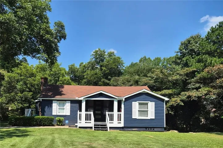 Blue siding exterior with white trim