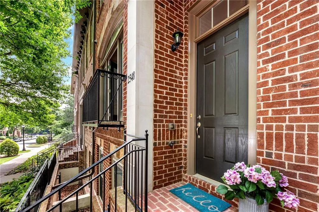 Entrance to property with brick siding