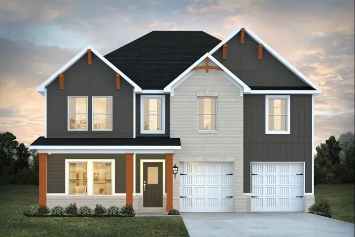 Two-story exterior with a combination of light-colored brick and dark vertical siding