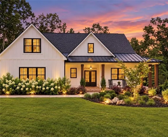 White board-and-batten exterior with dark trim windows