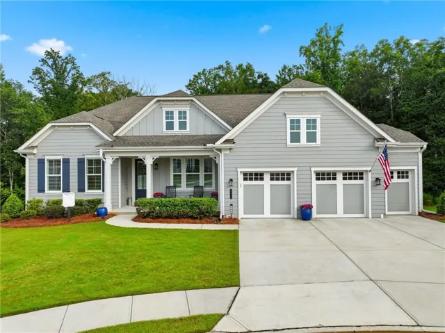 Light gray siding exterior with dark blue window shutters