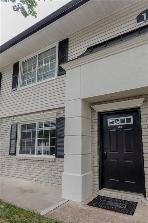 Property entrance with brick siding